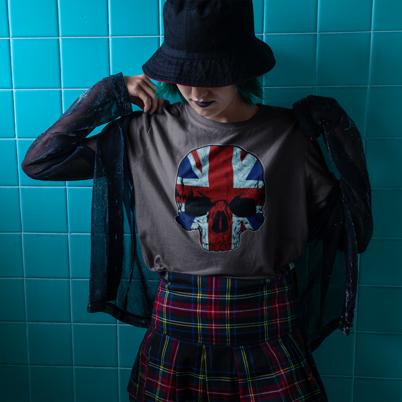 Person wearing a shirt with a Union Jack design against a blue tiled wall